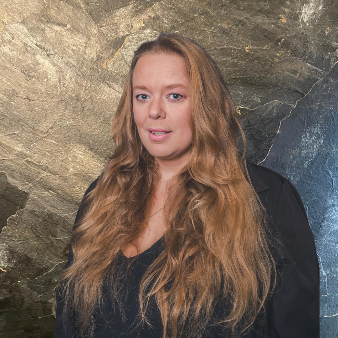 a woman with long blonde hair is wearing a black shirt