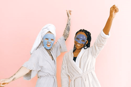 Two woman having the best spa day wearing robes