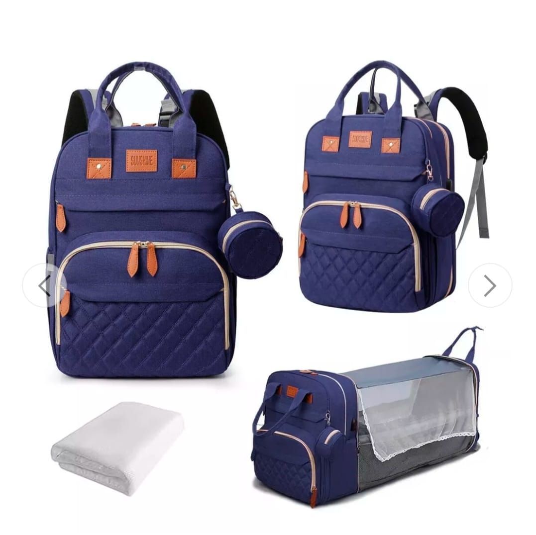 Conjunto de bolso cambiador azul marino con estuche de transporte, cambiador y accesorio circular.