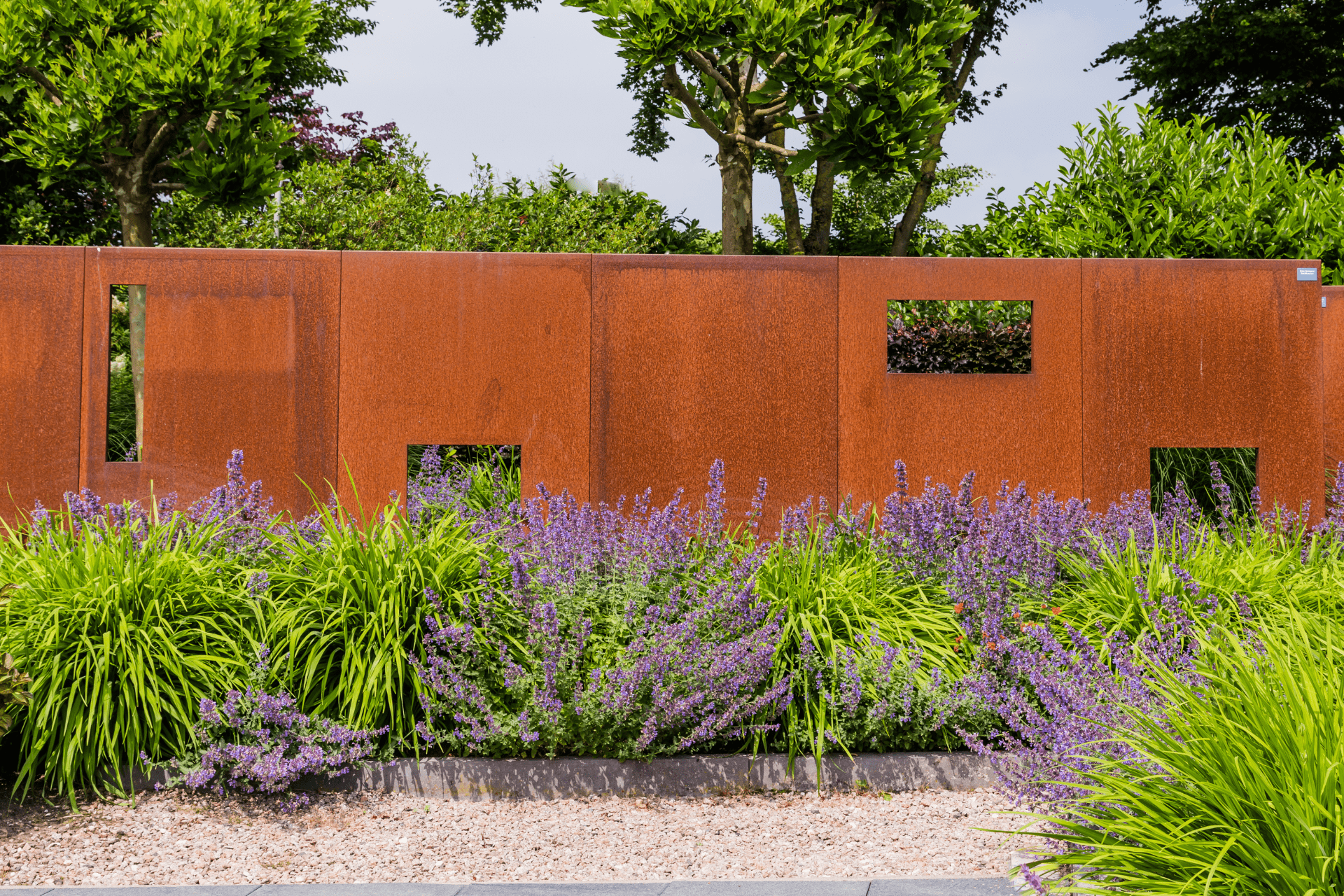 Brown privacy screen installed in a garden by Boise Landscaping Company