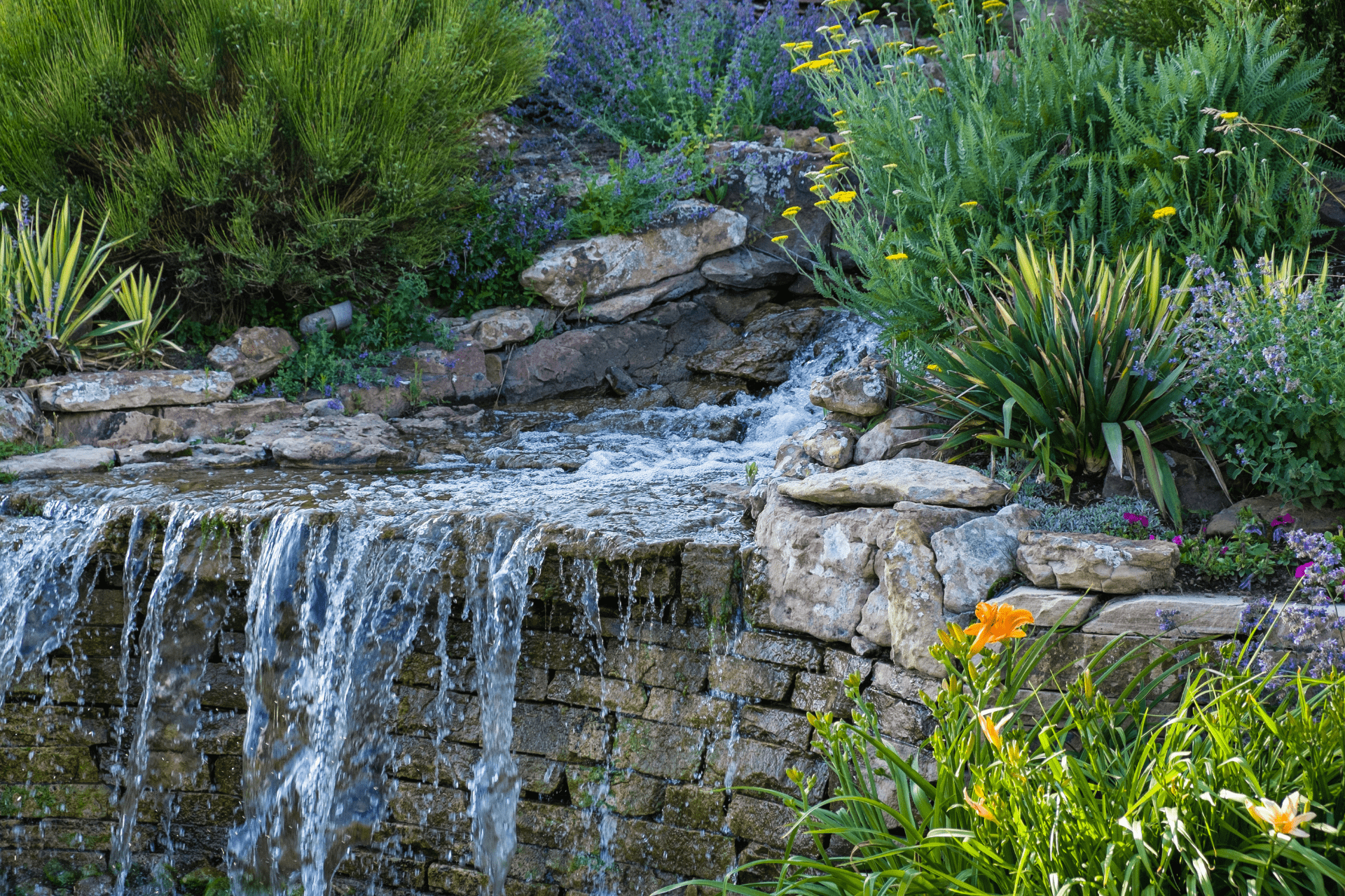 Simple stone waterfall in garden built by Boise Landscaping Company