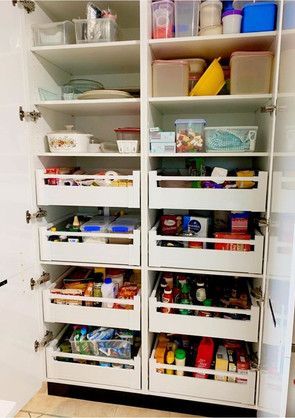 A pantry filled with lots of food and containers.