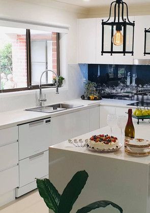 There is a cake on the counter in the kitchen.