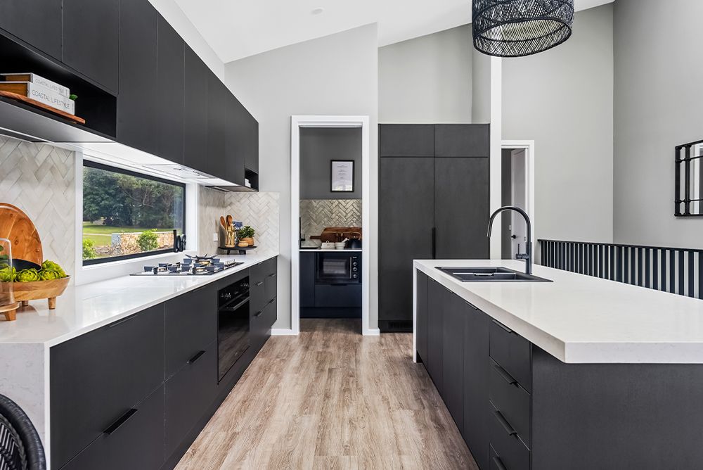 A kitchen with a stove, oven, and dishwasher. A kitchen with a stove, oven, and dishwasher.