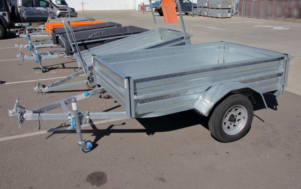 Several Small Utility Trailers In A Parking Lot — Soward Steel & Aluminium Fabrication in South Lismore, NSW