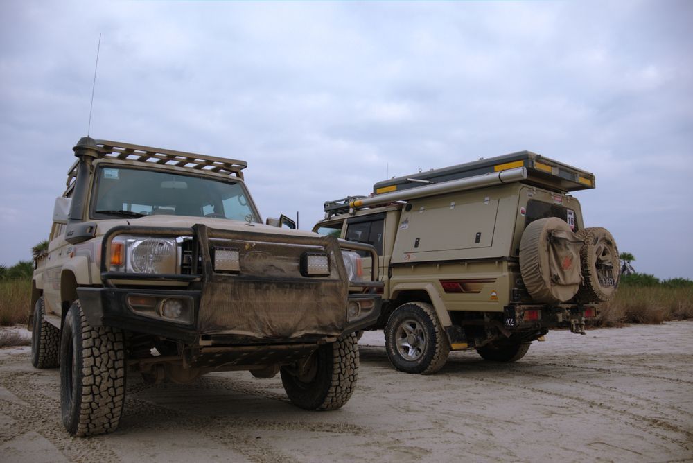 Two Tan Off-road Vehicles Parked On A Sandy Surface — Soward Steel & Aluminium Fabrication in South Lismore, NSW