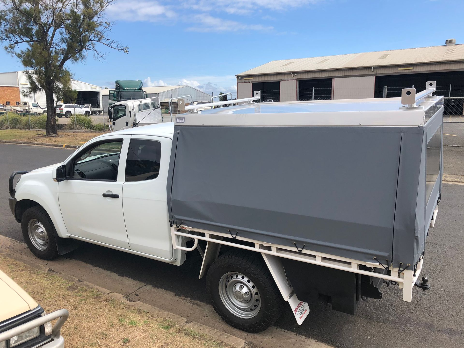 White Pickup Truck With Grey Canopy Parked On A Street — Soward Steel & Aluminium Fabrication in South Lismore, NSW