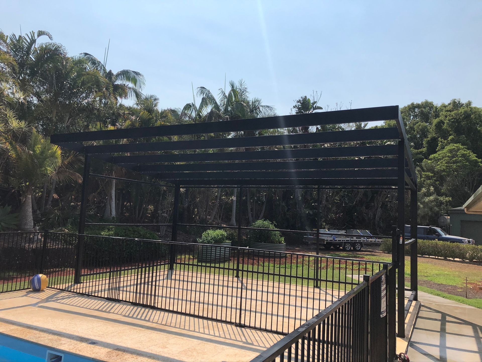 Black Pergola Over A Pool, Black Fence — Soward Steel & Aluminium Fabrication in South Lismore, NSW