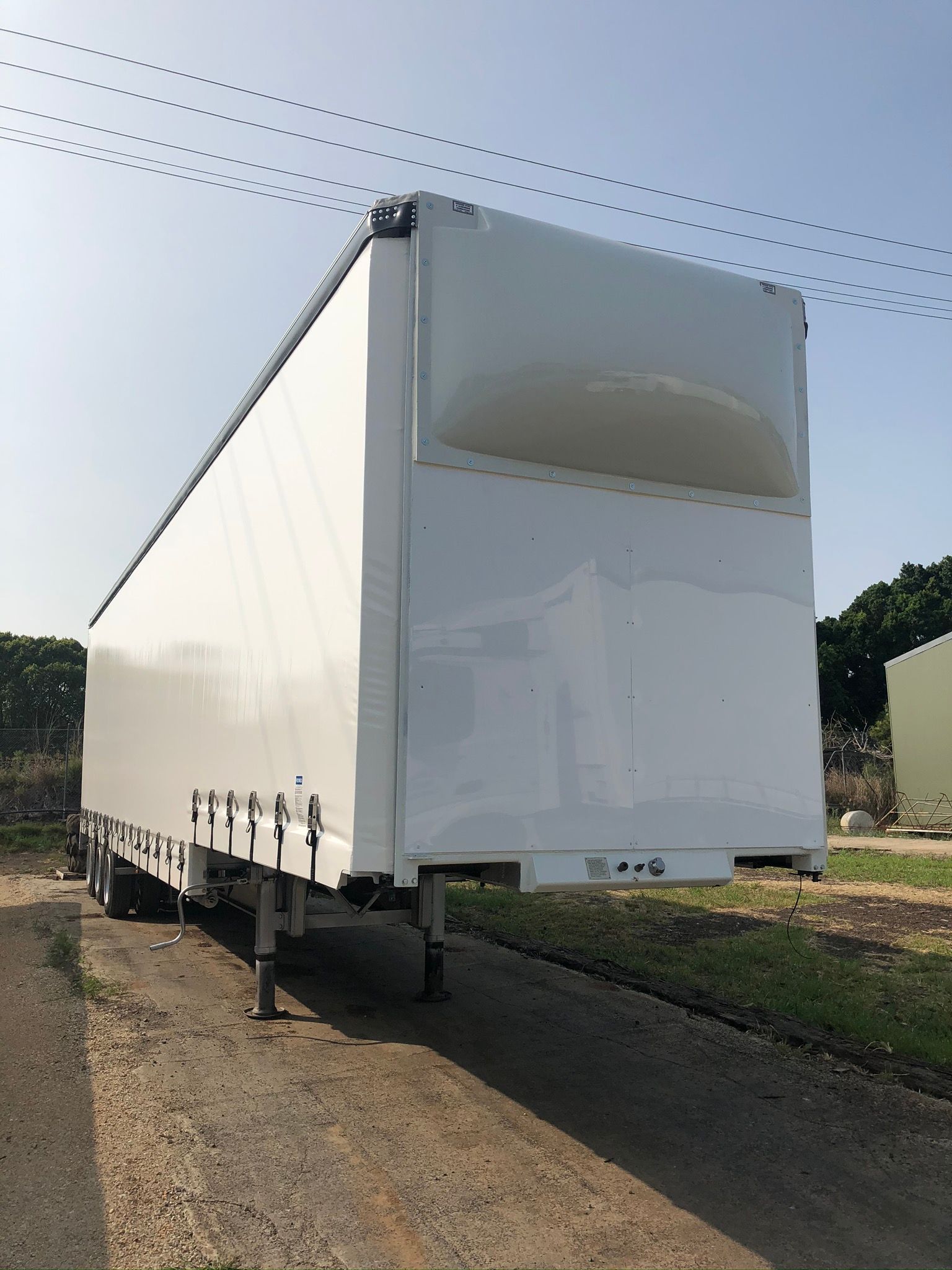 White Semi-trailer Parked Outdoors On A Sunny Day — Soward Steel & Aluminium Fabrication in South Lismore, NSW