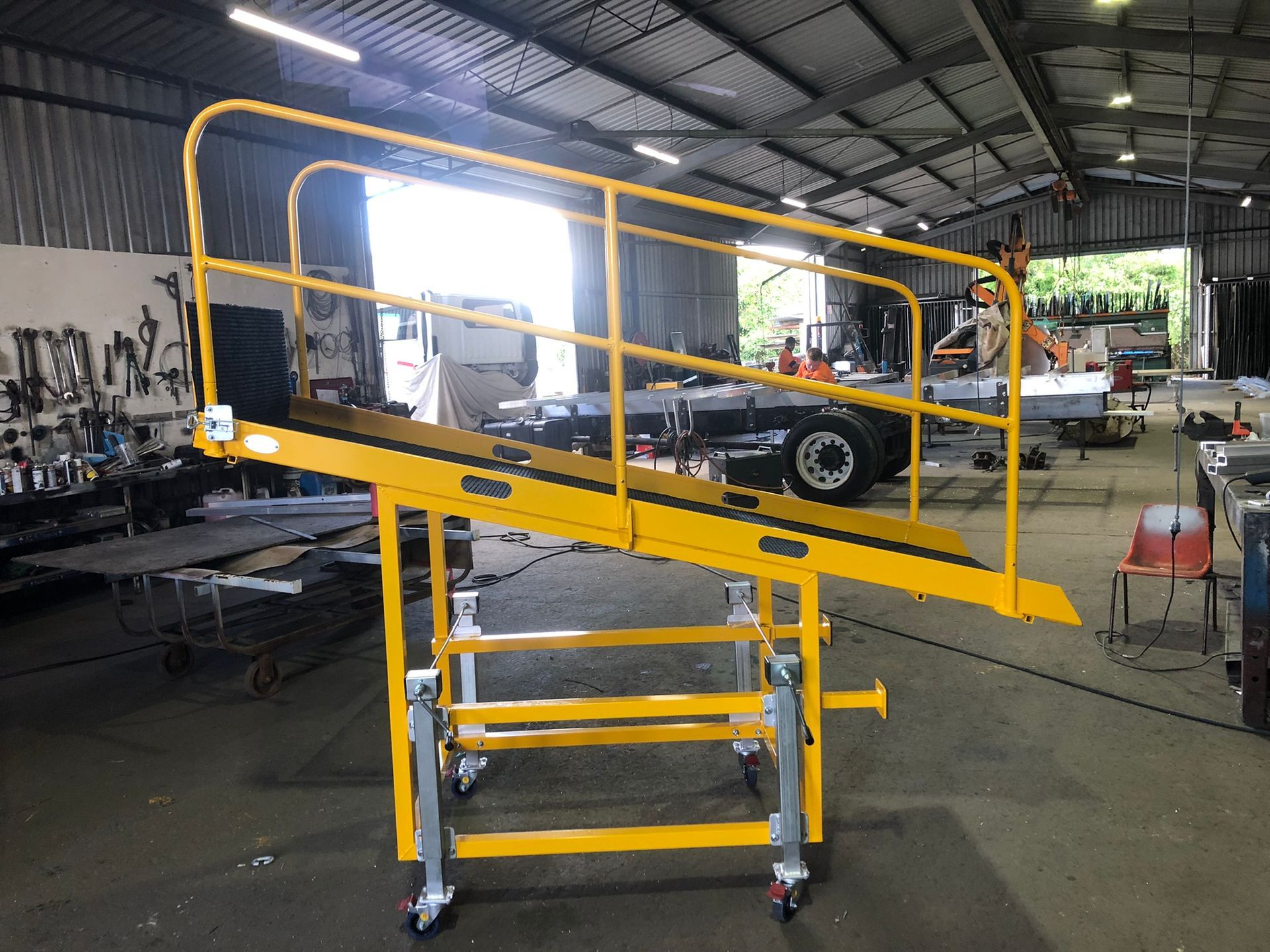 Yellow Industrial Mobile Access Platform With Ramp And Railings — Soward Steel & Aluminium Fabrication in South Lismore, NSW