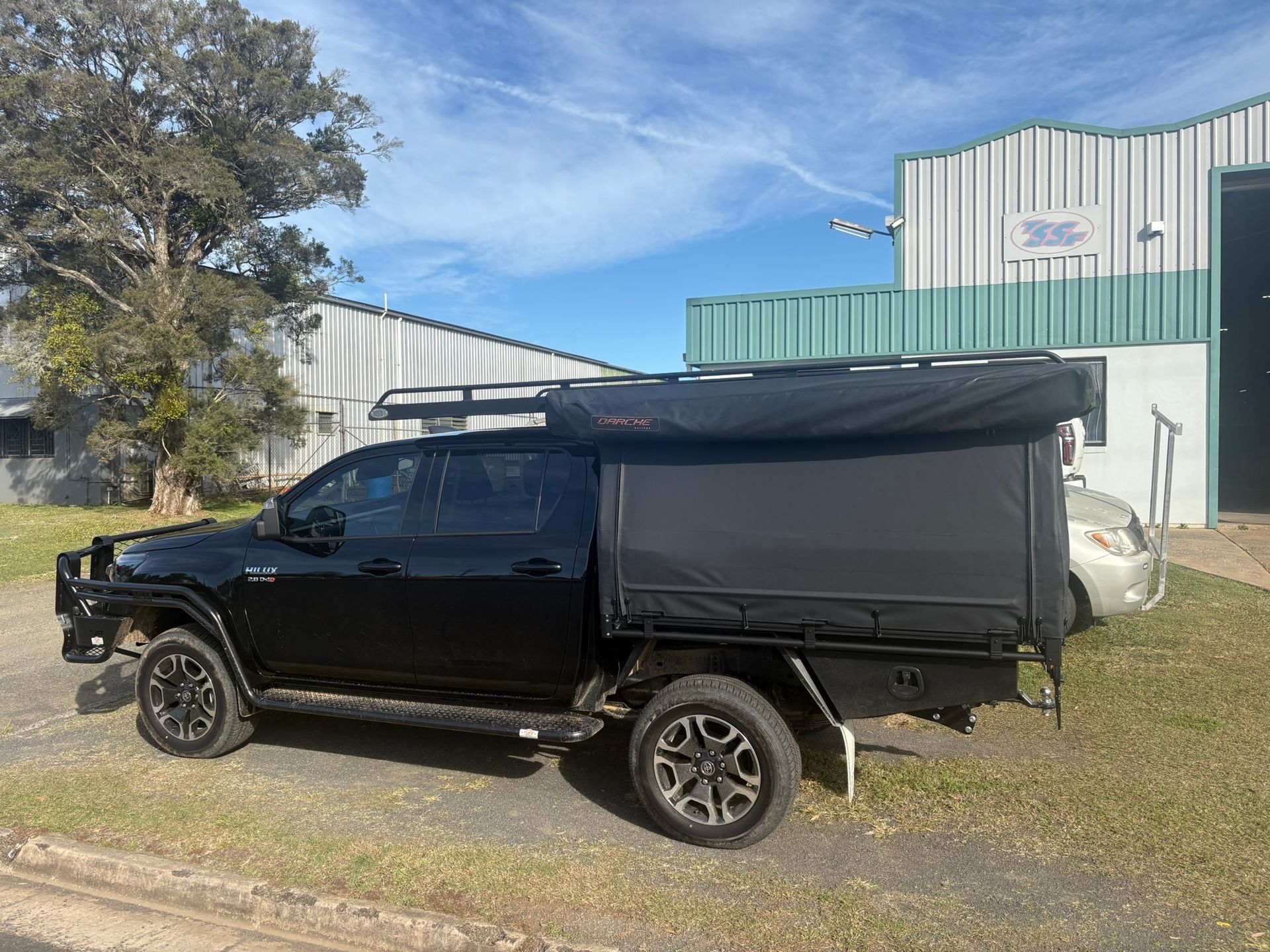 Black Pickup Truck With Camper Shell Parked Outside A Building — Soward Steel & Aluminium Fabrication in South Lismore, NSW