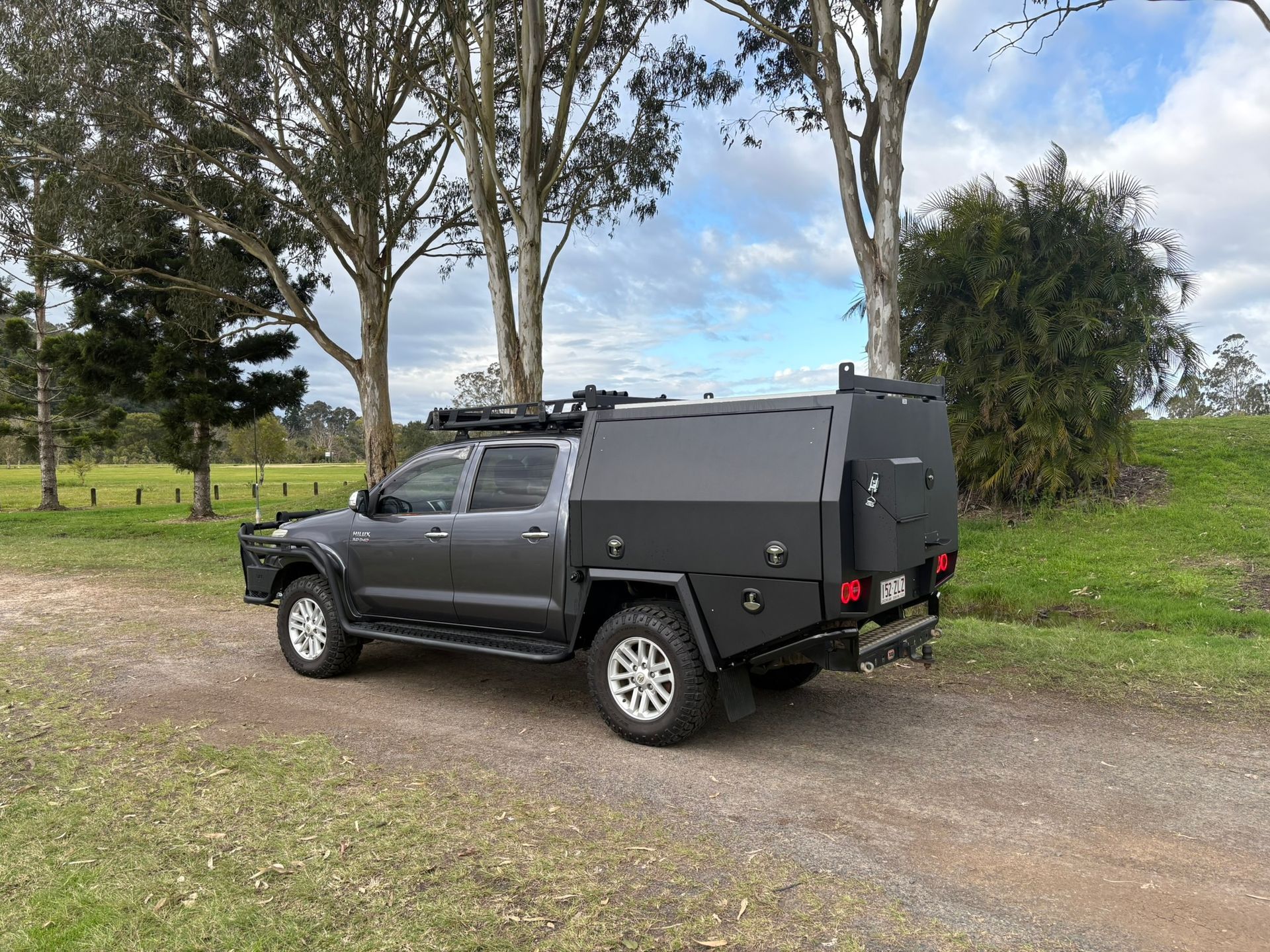 Gray Pickup Truck With Black Canopy On A Dirt Road — Soward Steel & Aluminium Fabrication in Byron Bay, NSW