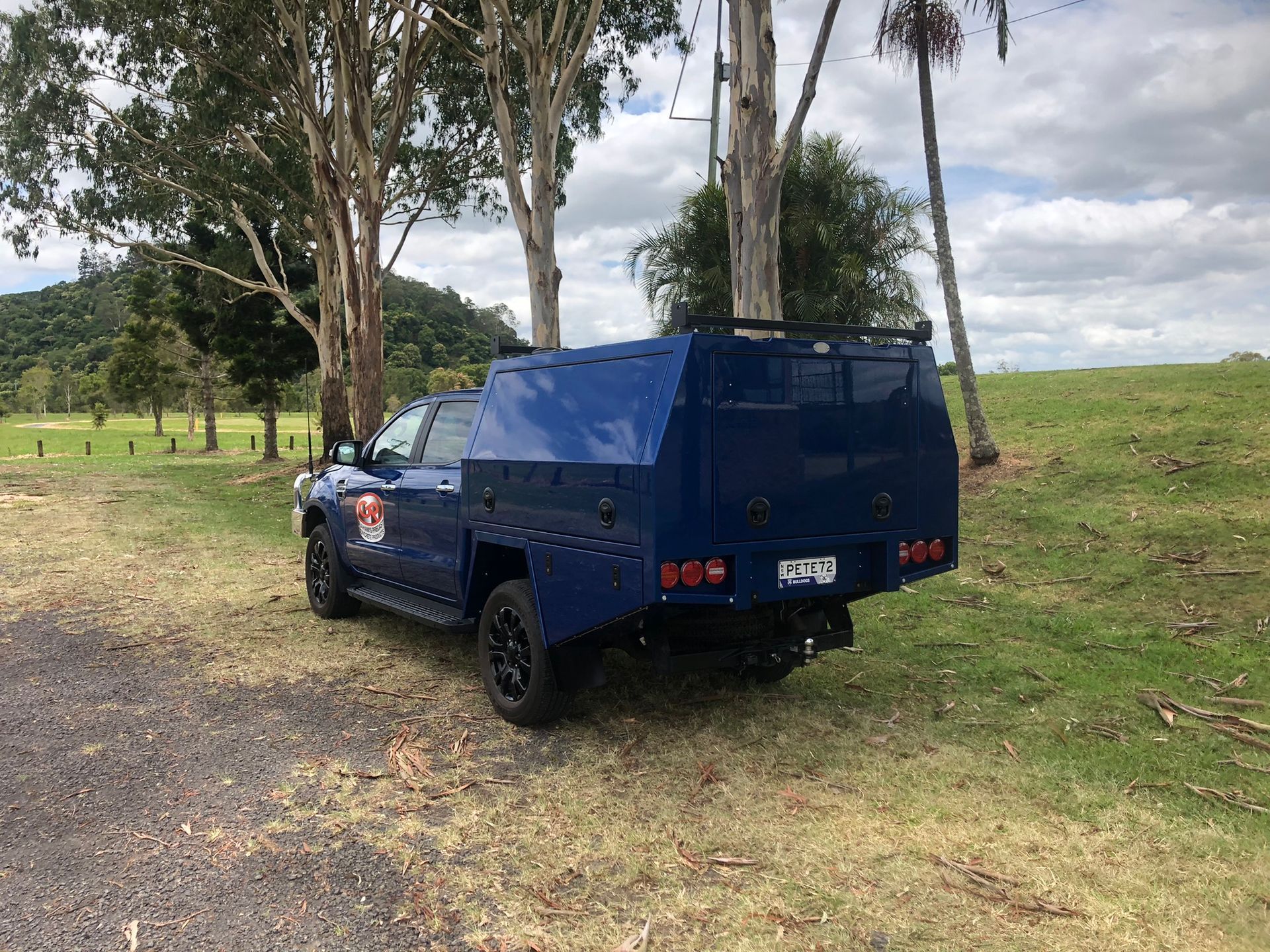 Blue Pickup Truck With Custom Canopy Parked On A Dirt Path — Soward Steel & Aluminium Fabrication in South Lismore, NSW