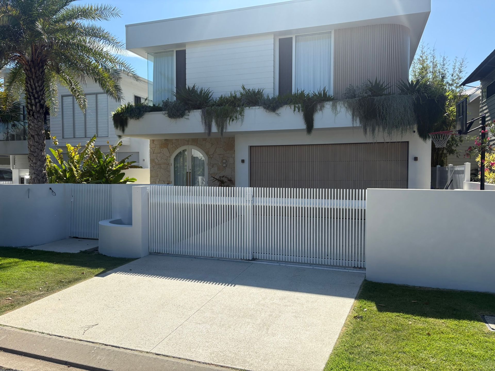 Two-story White House With Light-coloured Driveway — Soward Steel & Aluminium Fabrication in Casino, NSW