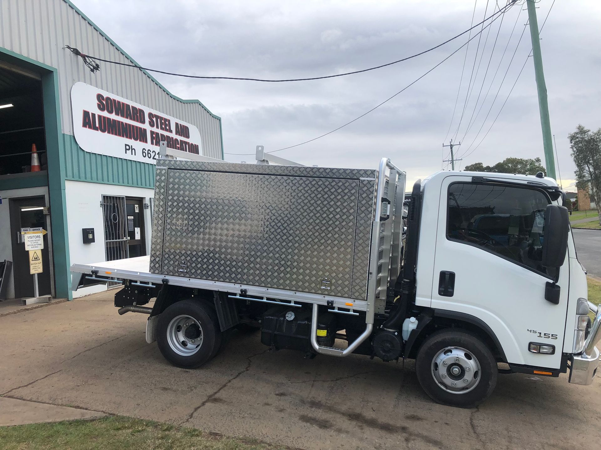 White Truck With Aluminum Storage, Parked Outside A Building — Soward Steel & Aluminium Fabrication in Lismore, NSW
