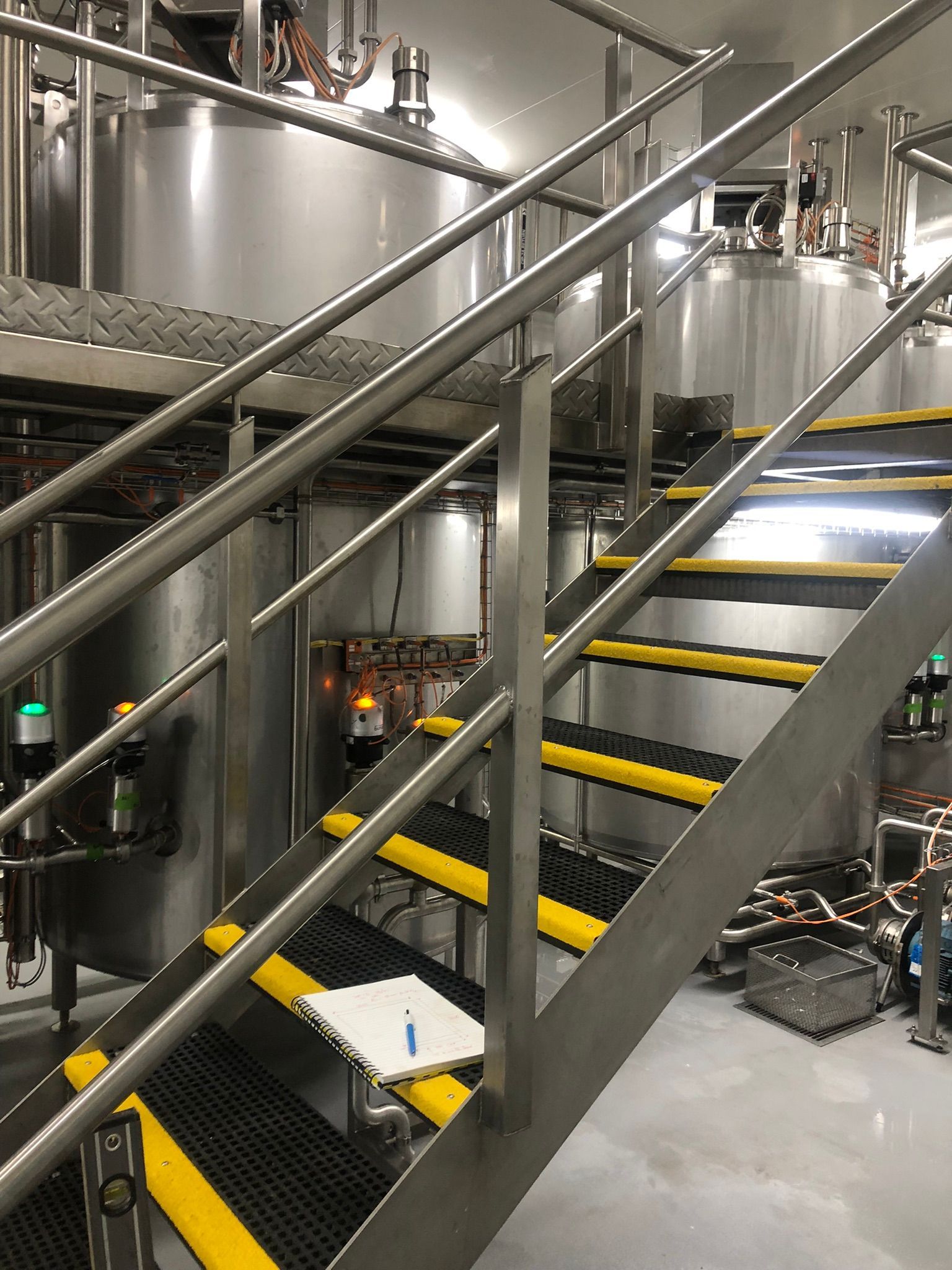 Stainless Steel Tanks In A Brewery With Stairs — Soward Steel & Aluminium Fabrication in South Lismore, NSW