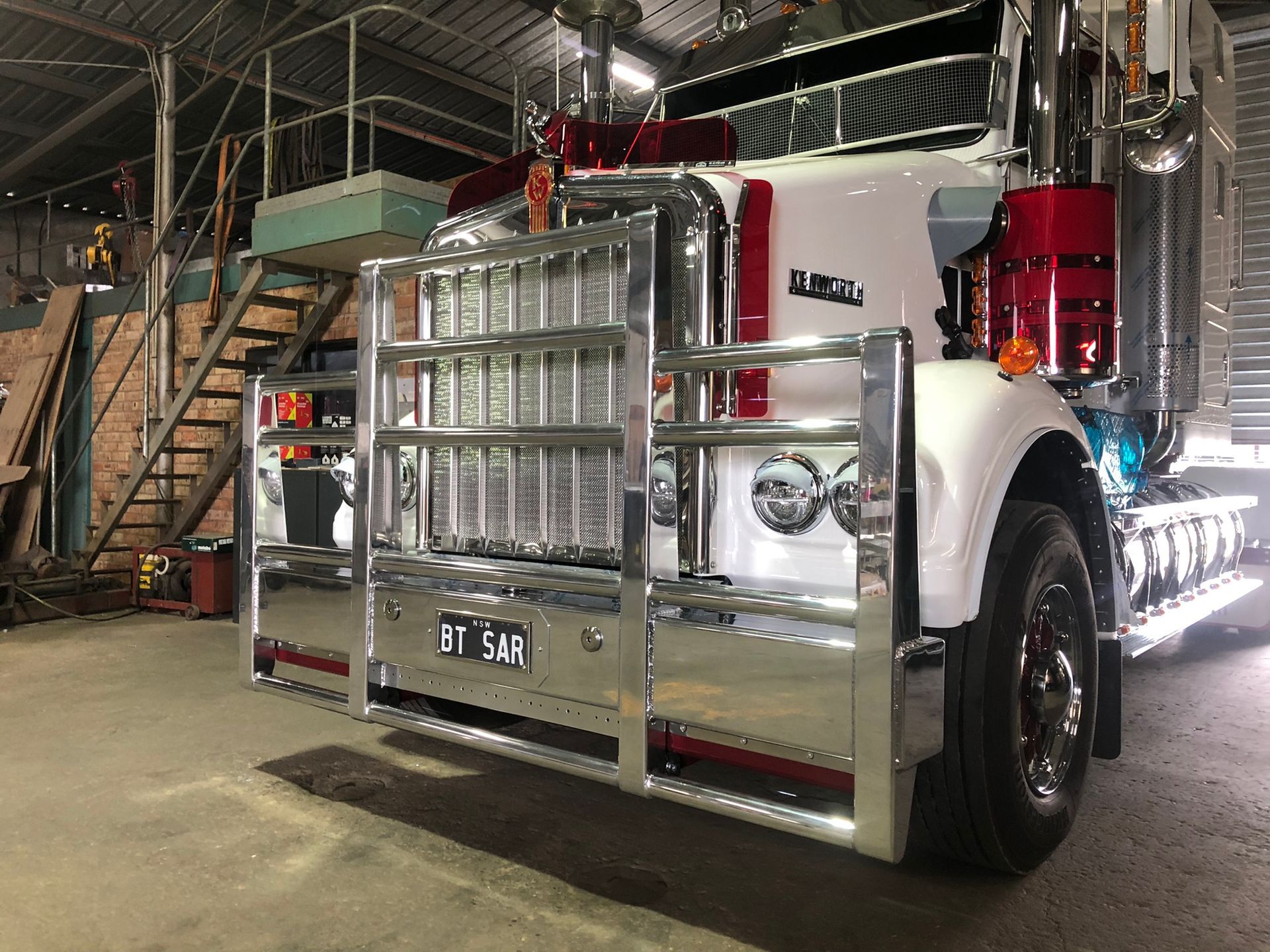Shiny White And Red Semi-truck With Chrome Grill And Bumper — Soward Steel & Aluminium Fabrication in South Lismore, NSW