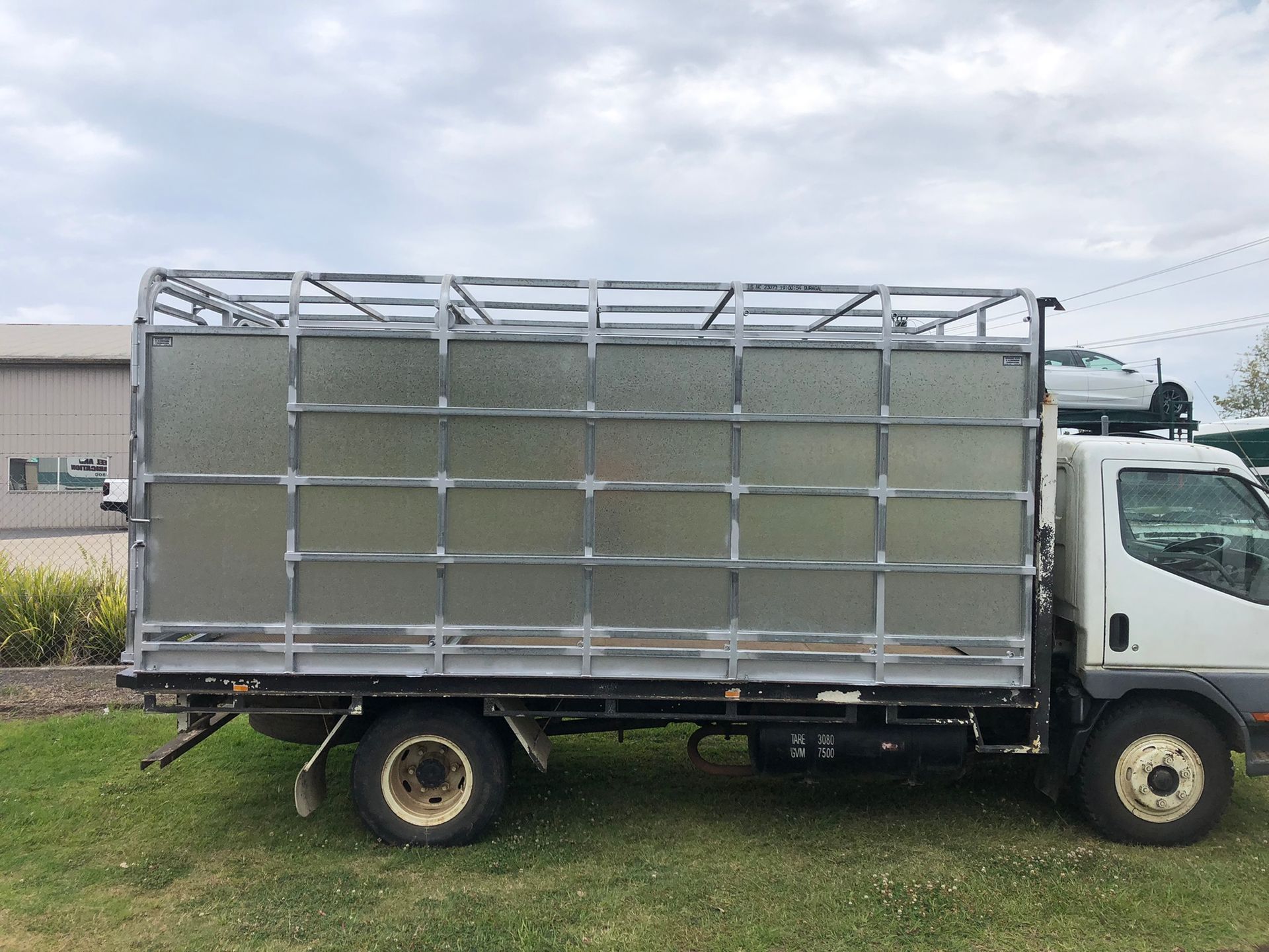 White Truck With A Caged Cargo — Soward Steel & Aluminium Fabrication in South Lismore, NSW