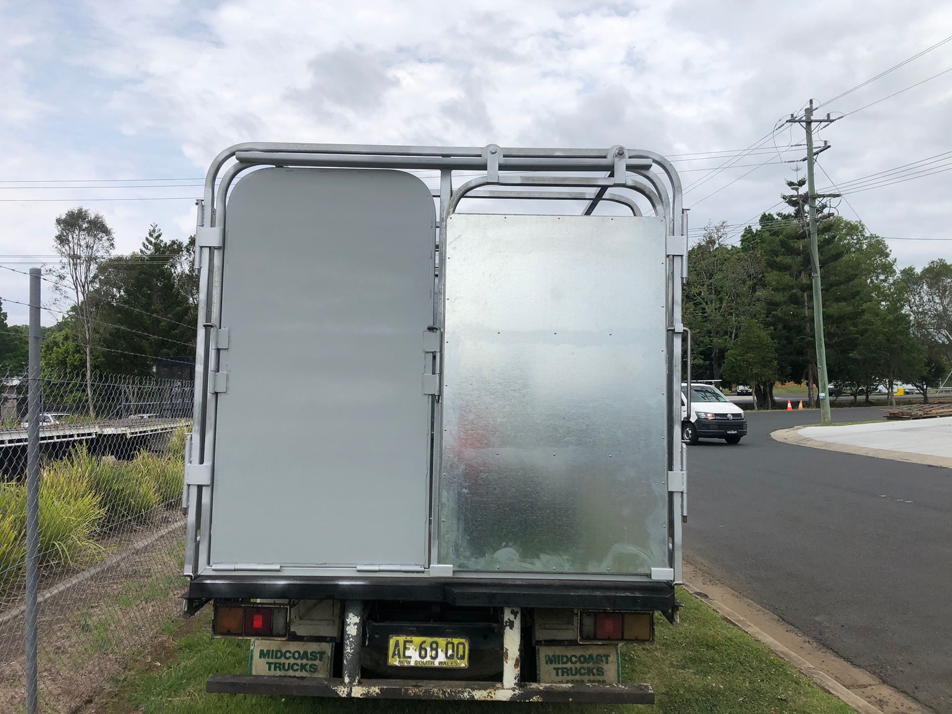 Rear View Of A Light-duty Truck With Metal Cage And Doors — Soward Steel & Aluminium Fabrication in South Lismore, NSW