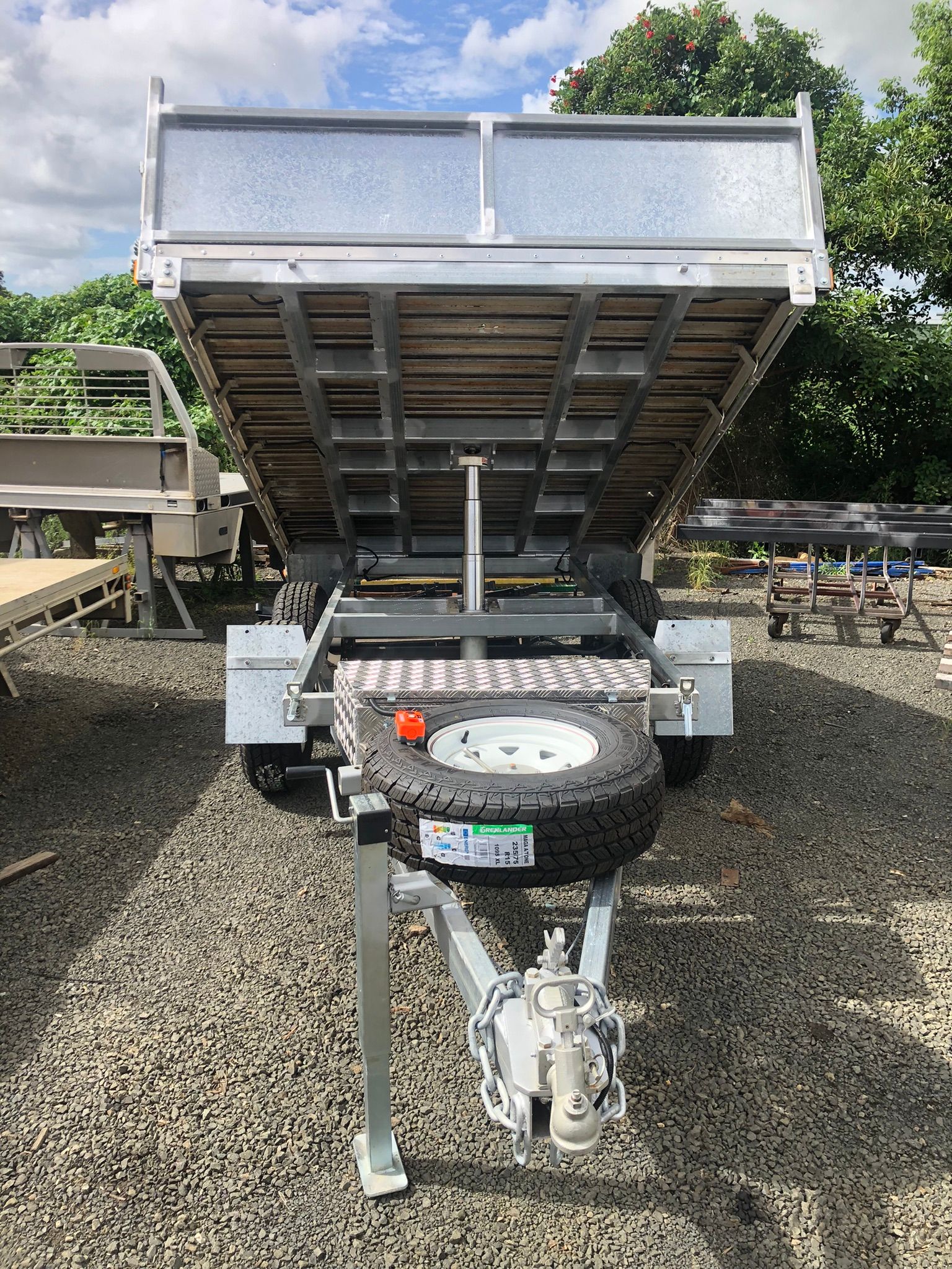 A Utility Trailer With A Raised Bed, Ready For Dumping — Soward Steel & Aluminium Fabrication in South Lismore, NSW