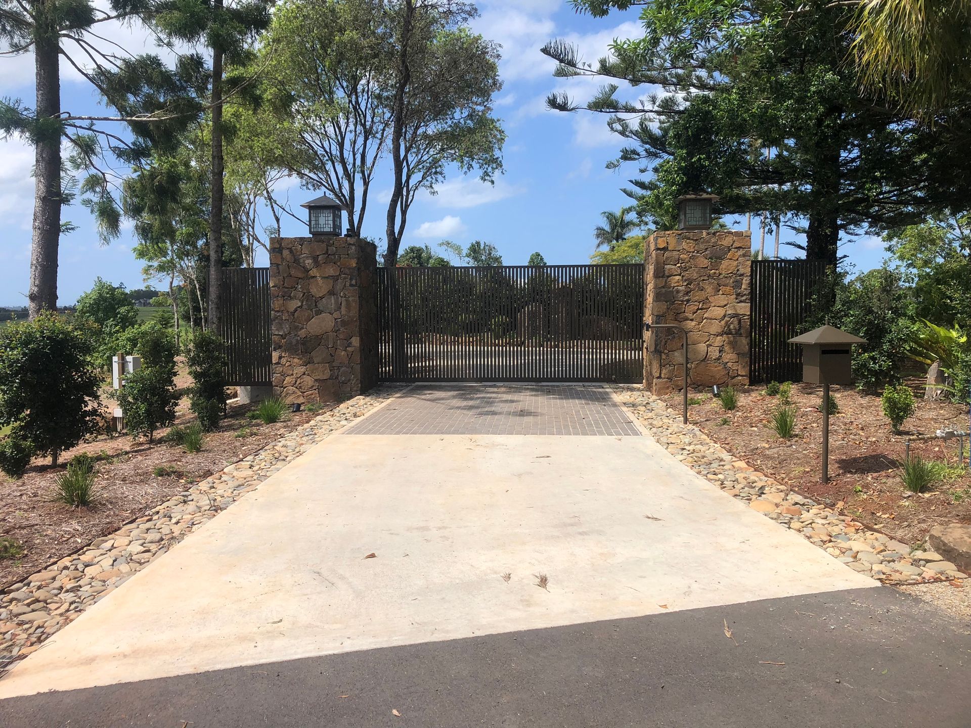 Stone Entrance Pillars Frame A Gated Driveway — Soward Steel & Aluminium Fabrication in South Lismore, NSW