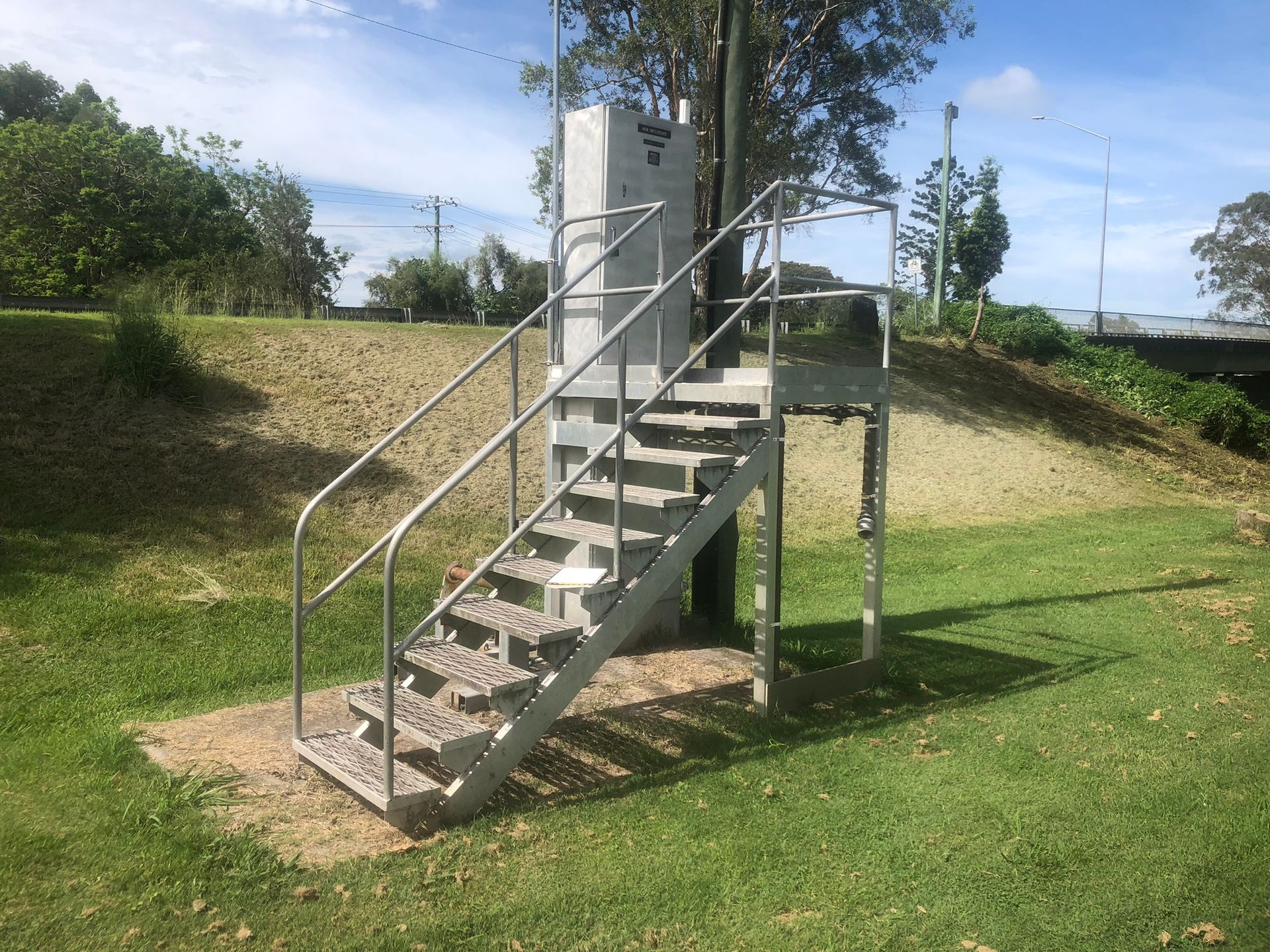 Metal Staircase Leading Up To A Concrete Structure — Soward Steel & Aluminium Fabrication in South Lismore, NSW
