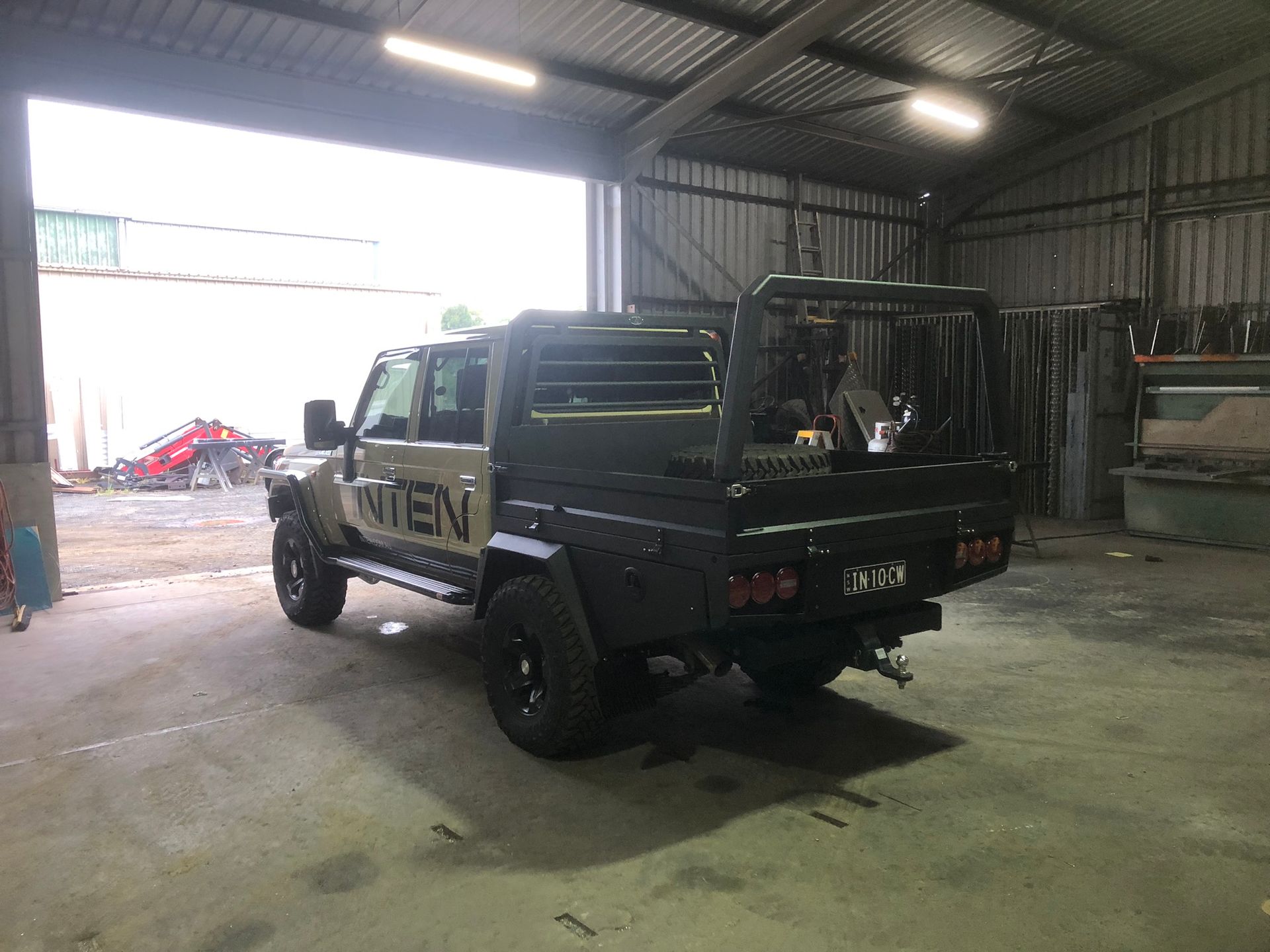 Tan And Black Utility Truck Inside A Garage. Metal Frame And Bed — Soward Steel & Aluminium Fabrication in South Lismore, NSW