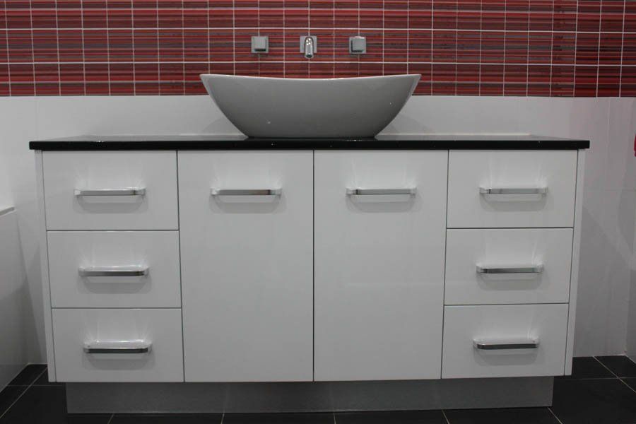 bathroom vanity with red tiles