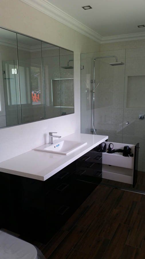 bathroom vanity with dark cabinets