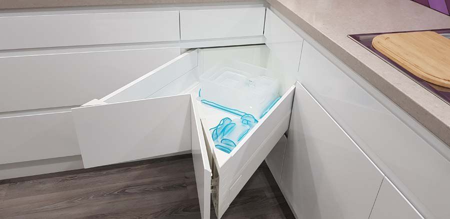 corner drawer open with tupperware