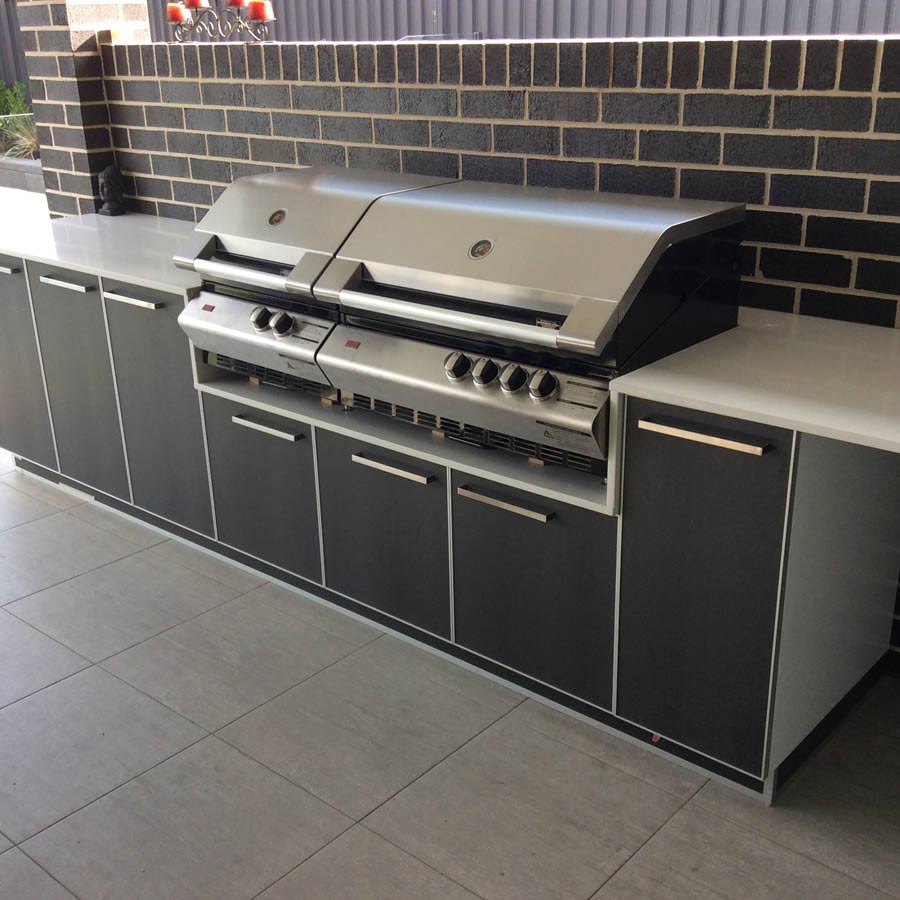 double grill with brick backsplash