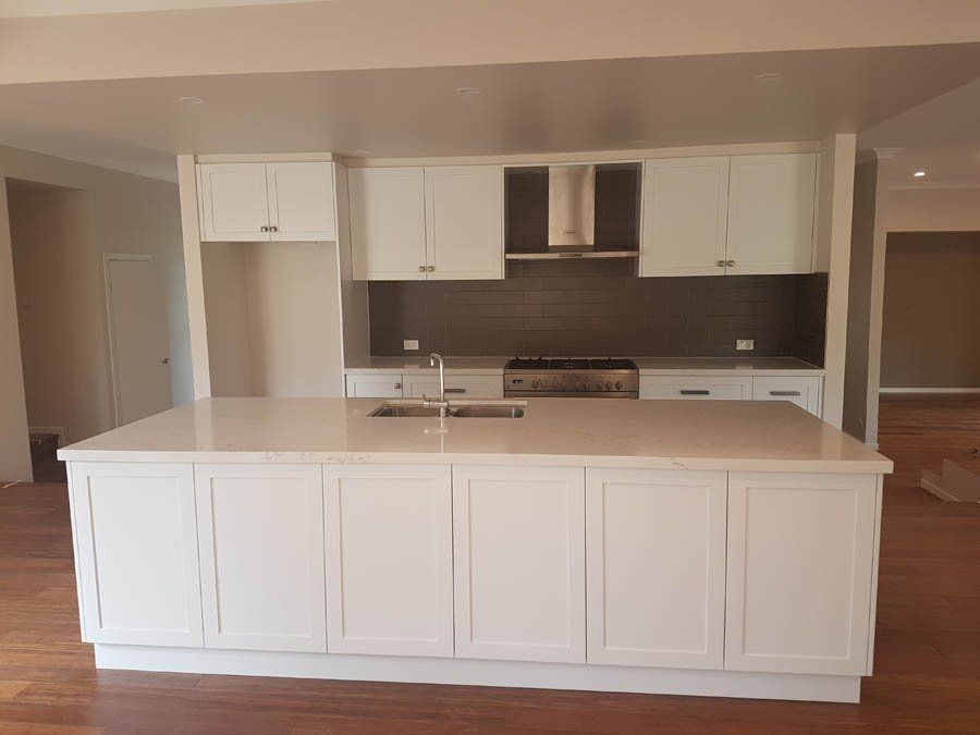 traditional kitchen with large white stone island