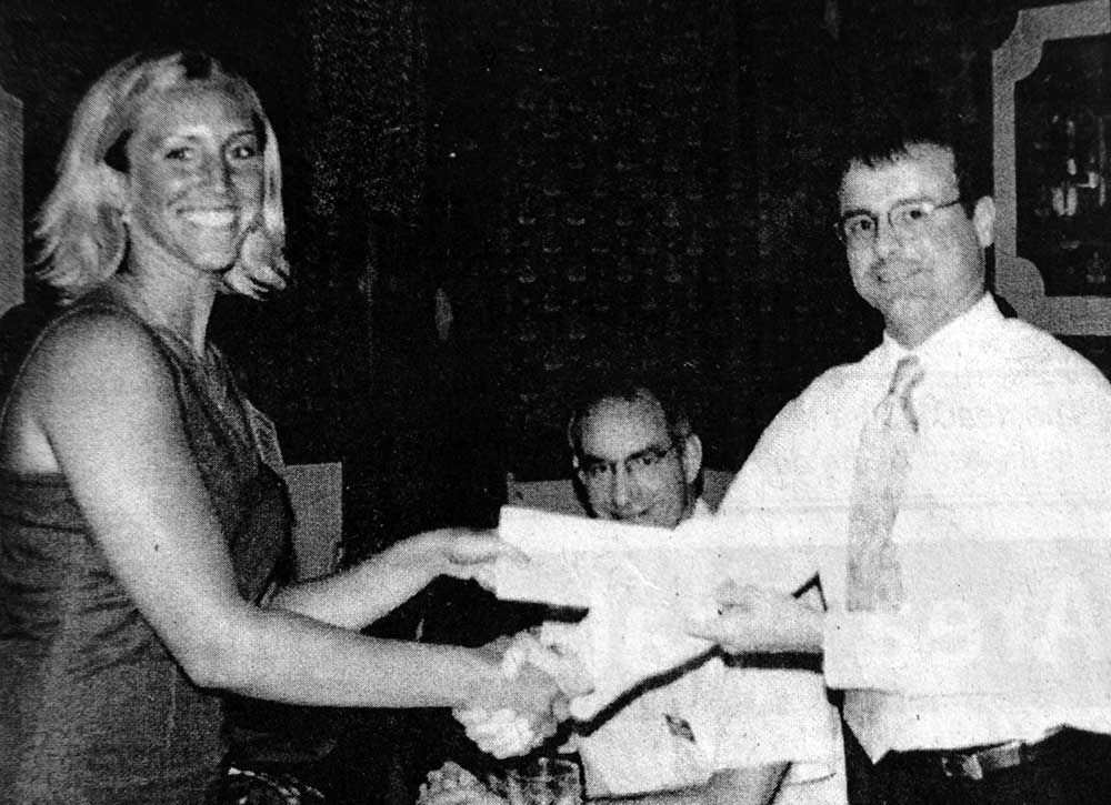 A black and white photo of two people shaking hands