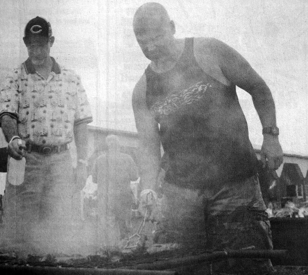 A man in a tank top with the letter c on it