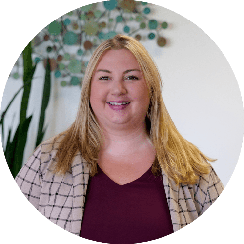 A woman is smiling for the camera in a circle.