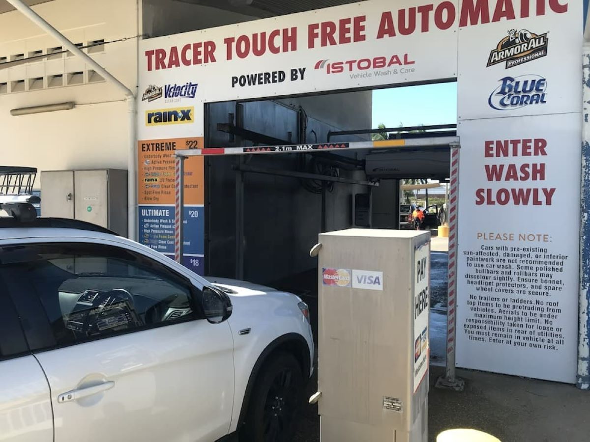 A White Car Is Parked in Front of A Car Wash — Whitsunday Wash In Bowen, QLD
