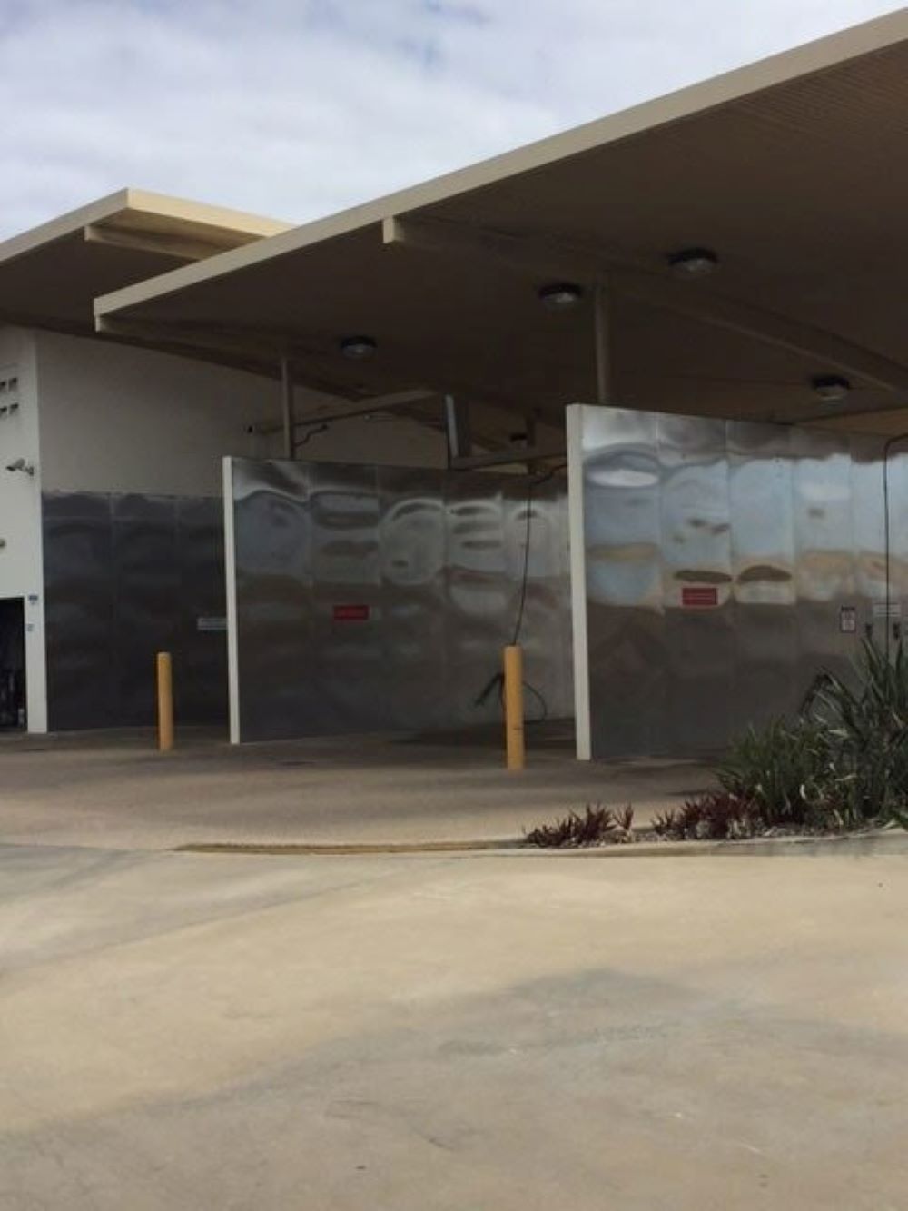 A Building with A Roof that Has the Word Pepsi on It — Whitsunday Wash In Bowen, QLD