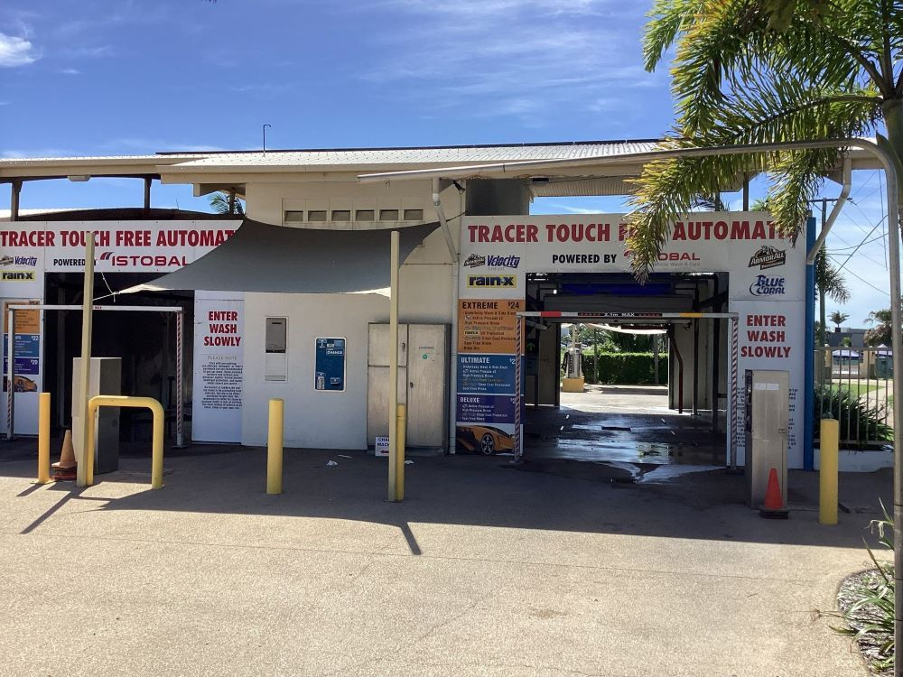 A Car Wash with A Sign that Says Tracer Touch Free Automatic — Whitsunday Wash In Bowen, QLD