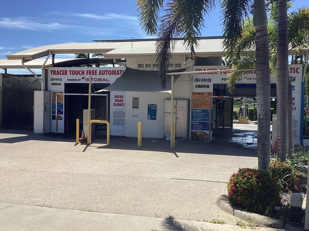 A White Building with A Sign that Says ' Trace Your Vehicle Automatic ' on It — Whitsunday Wash In Bowen, QLD