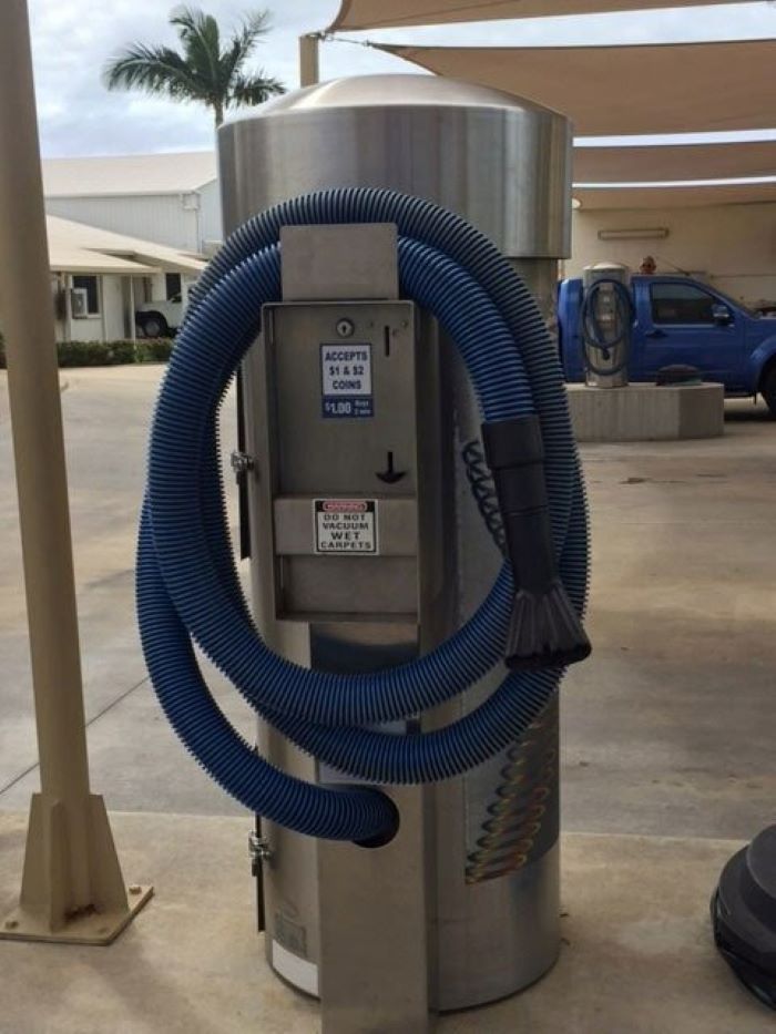 A Vacuum Cleaner with A Blue Hose Attached to It — Whitsunday Wash In Bowen, QLD