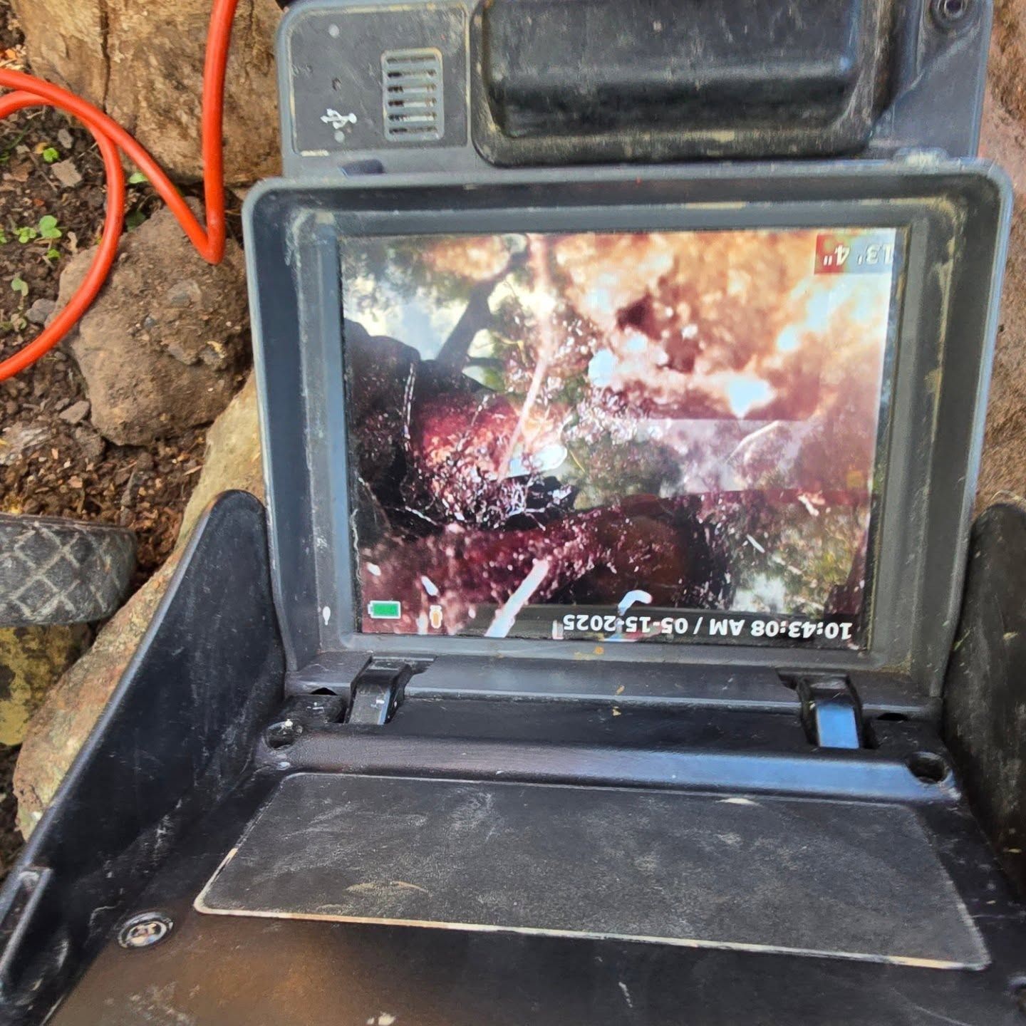 A sewer inspection robot travels through a dark pipe, capturing Full HD video.