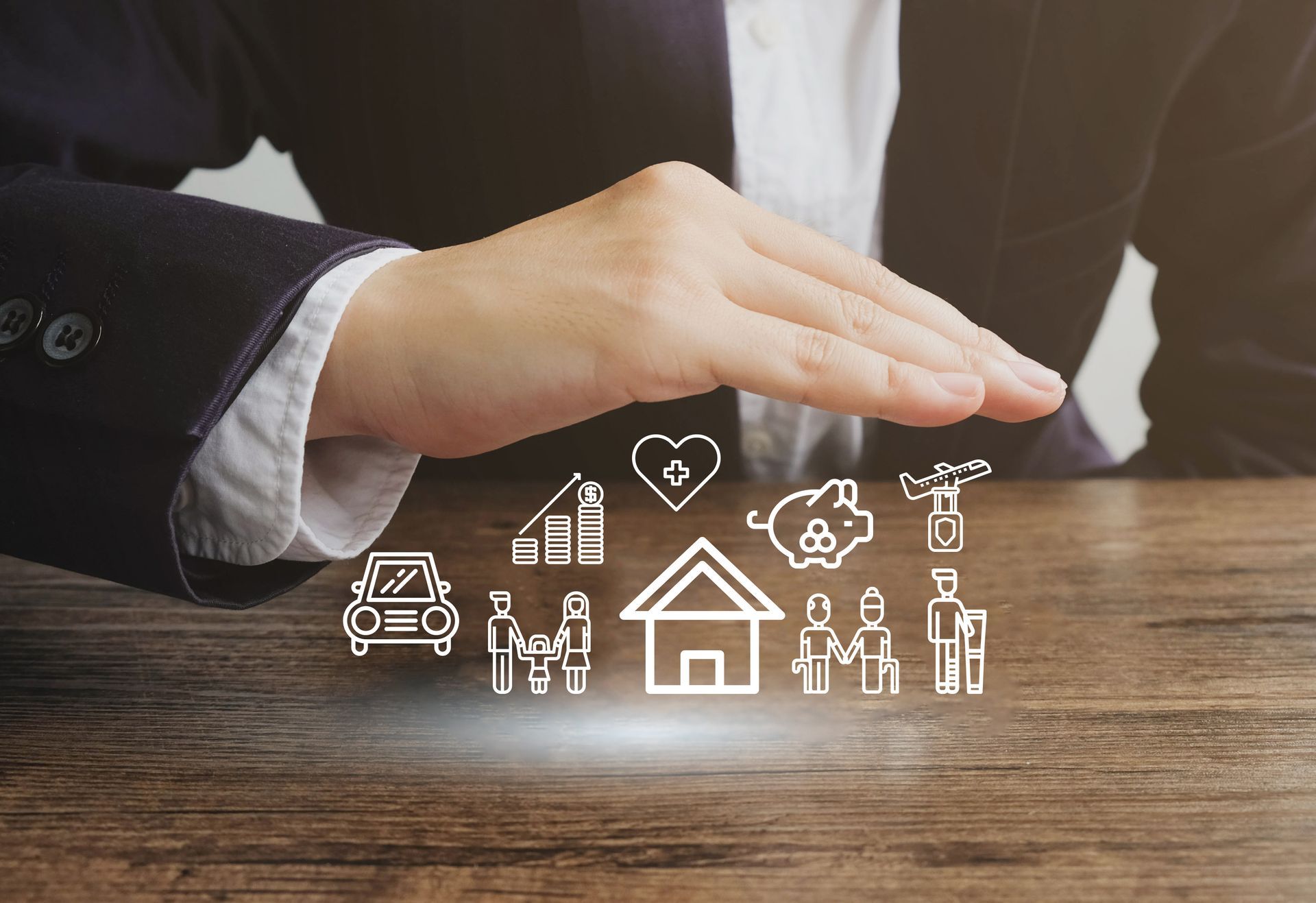 Businessperson gesturing over glowing house and home service icons on a wooden table
