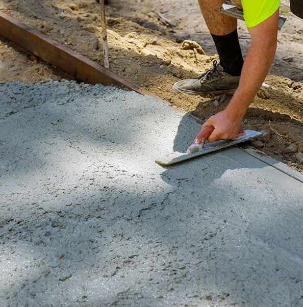 Worker Plastering the Concrete — Concrete Driveways in Port Macquarie, NSW