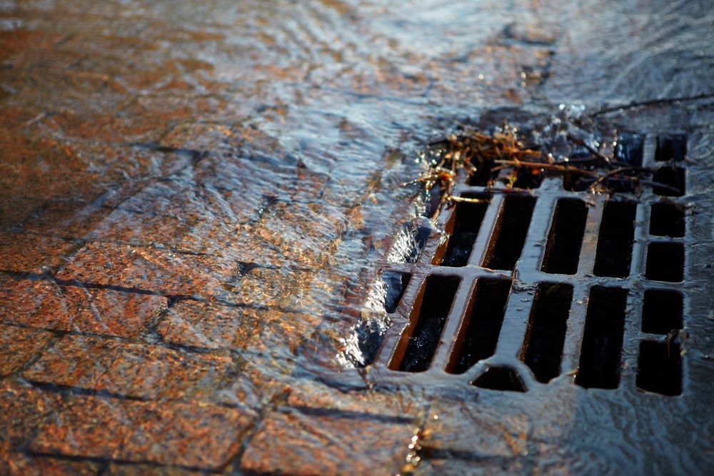 Water Flowing Over Brick Pavement — Fair Plumbing In Shellharbour, NSW