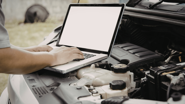 a mechanic doing a vehicle diagnostic