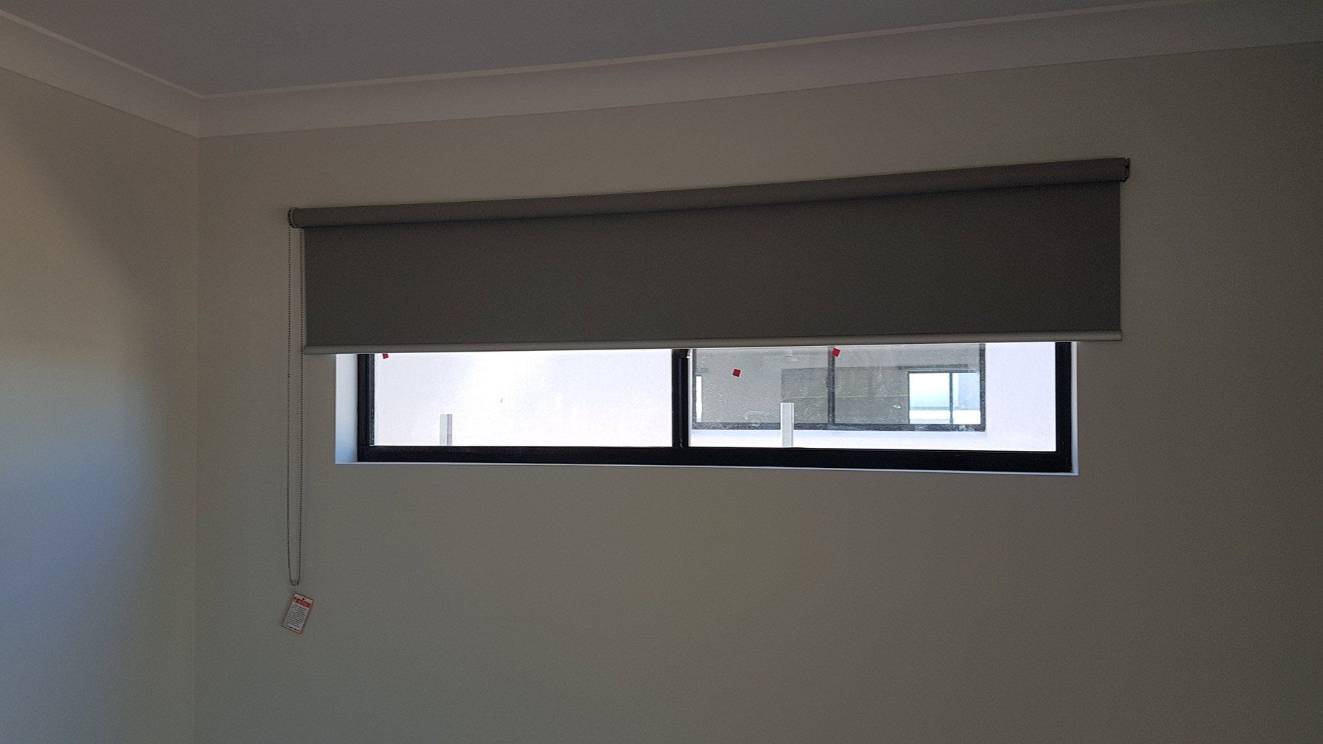 Half Rolled Down Gray Blinds — Blinds Installation in Winnellie, NT