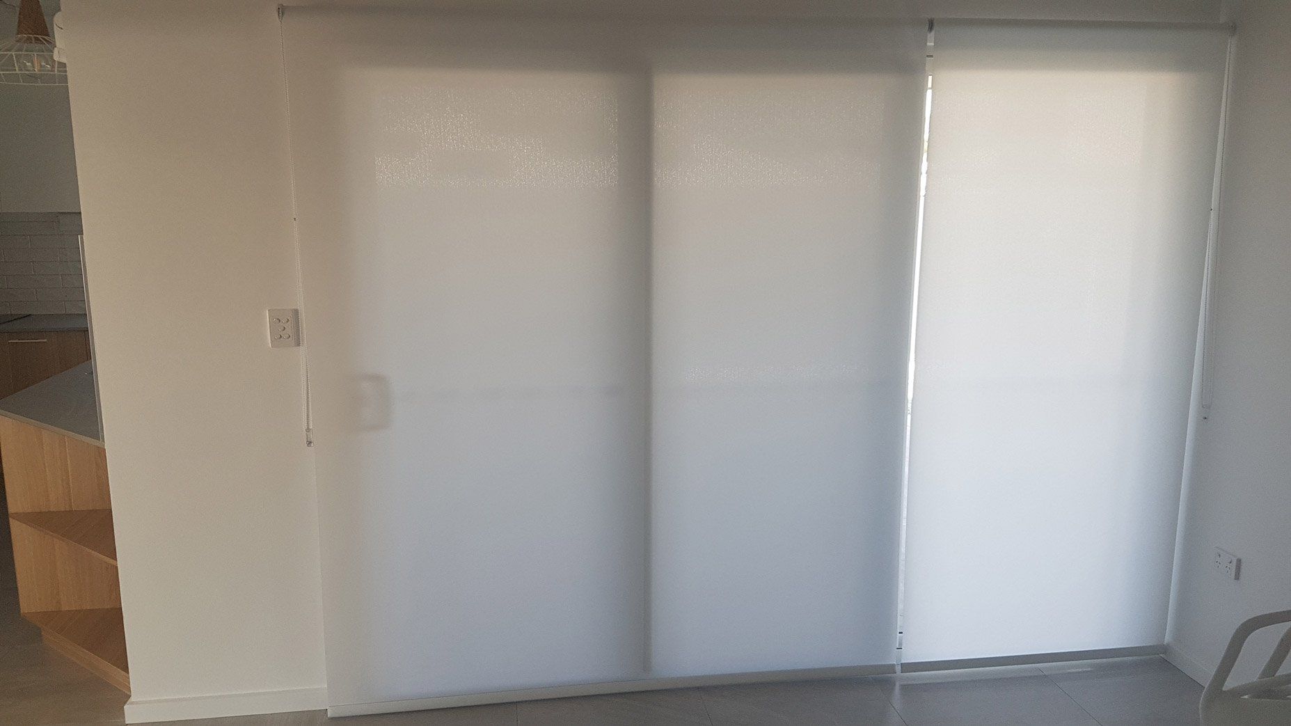 Sliding Doors With Rolled Down White Blinds — Blinds Installation in Winnellie, NT