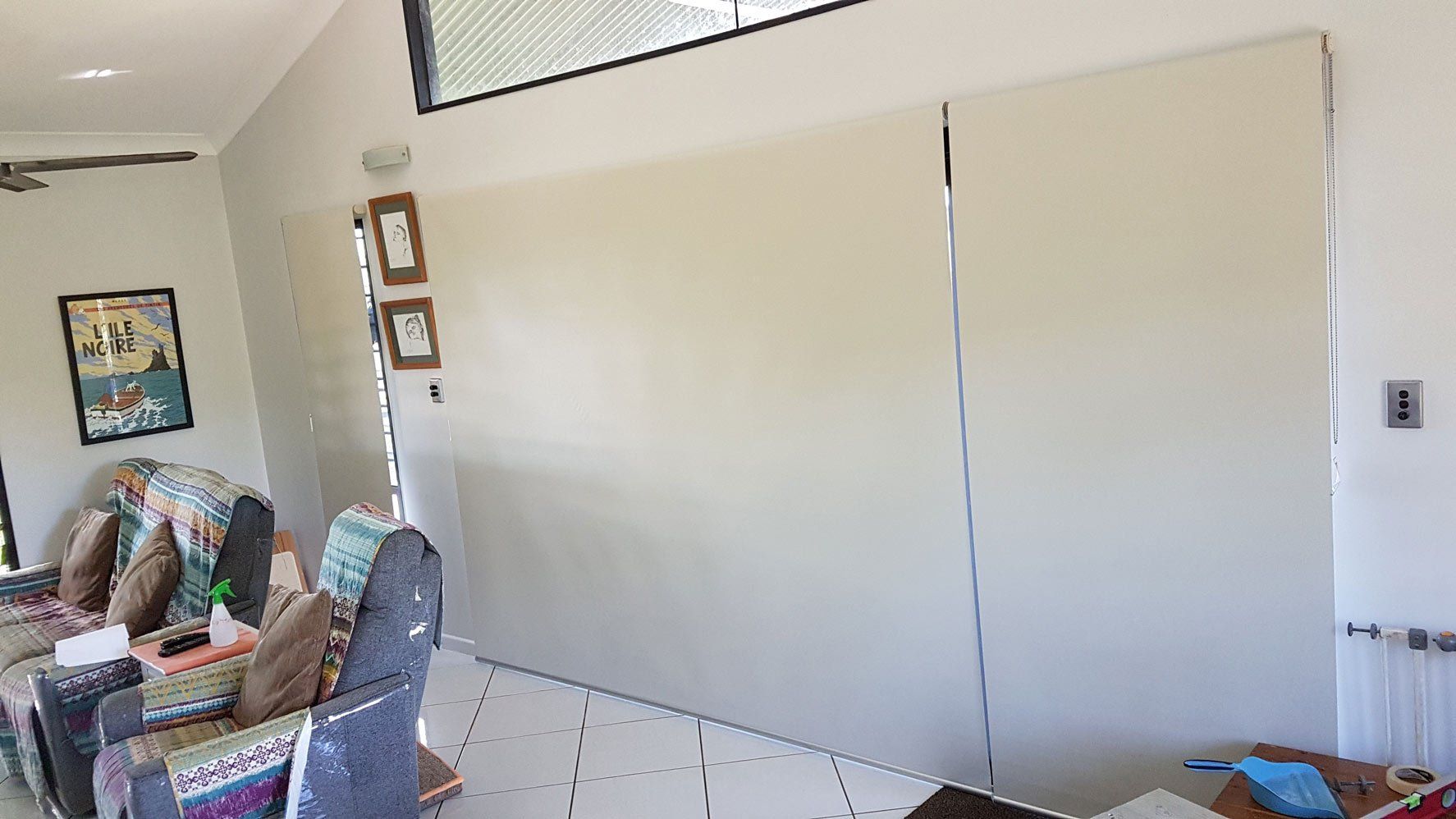 Rolled Down Blinds Near Sofa Set — Blinds Installation in Winnellie, NT