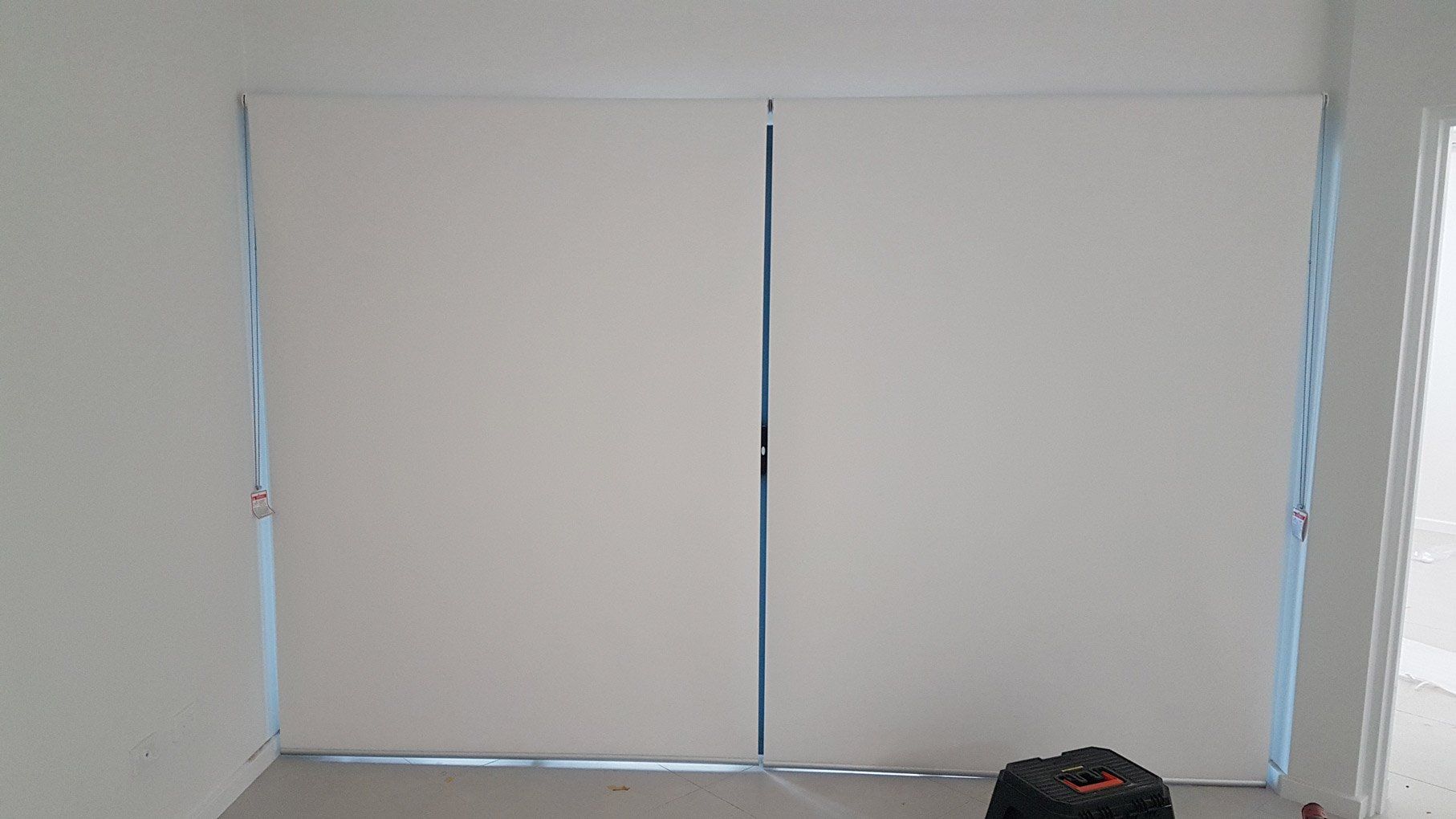 Two White Rolled Down Blinds — Blinds Installation in Winnellie, NT