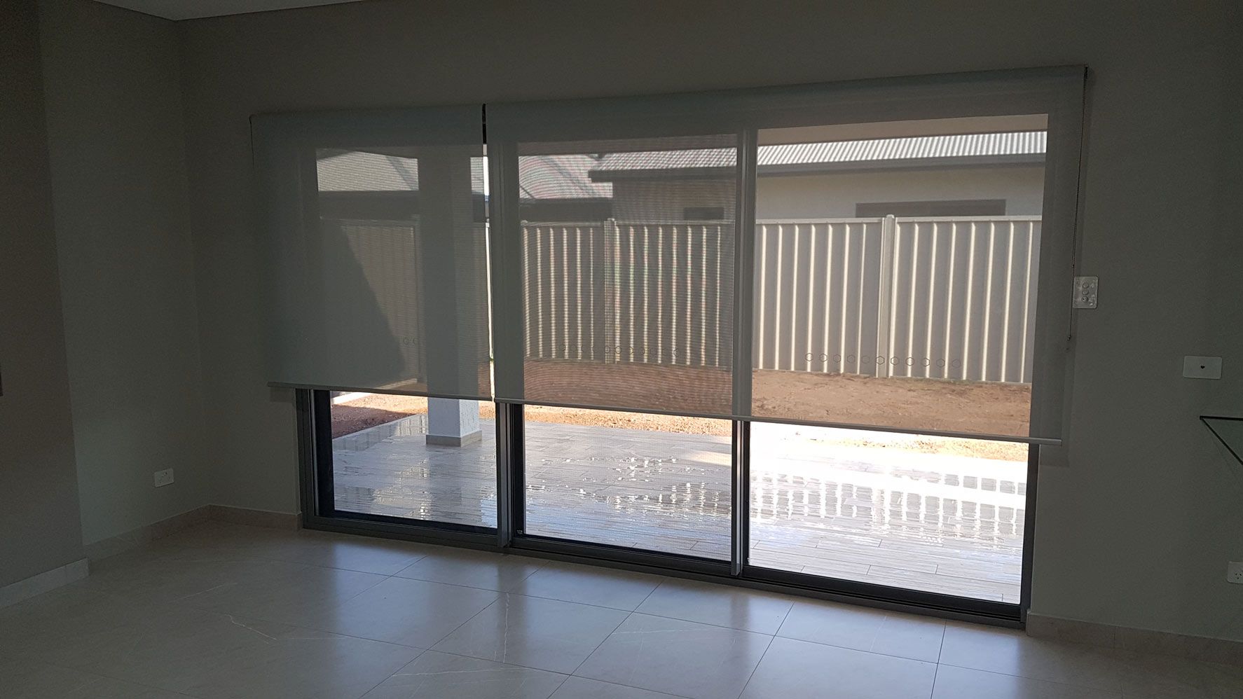 Sliding Door With Half Rolled Down Blinds — Blinds Installation in Winnellie, NT